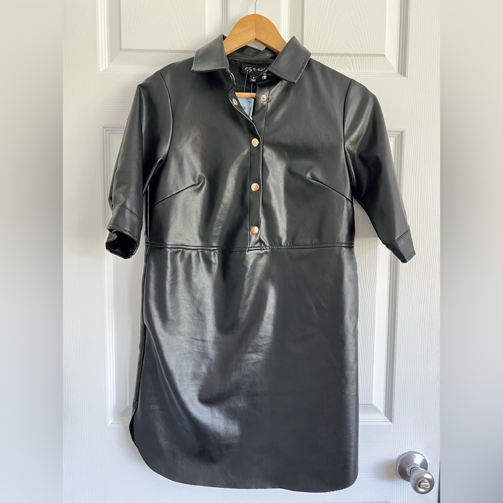 NWT size medium Say What? black vegan shirt dress.  3/4 sleeve snaps.  Collar